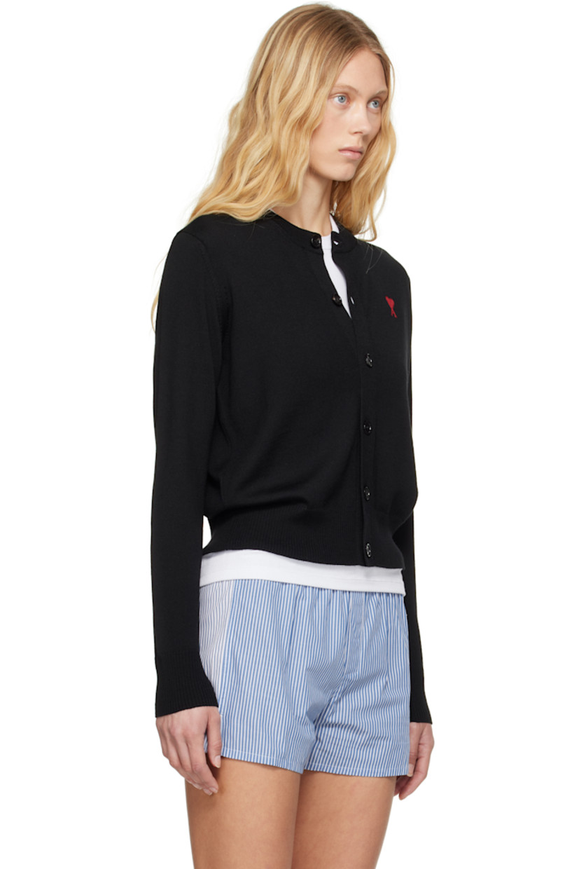 Knit merino wool cardigan.

· Rib-knit crewneck, placket, hem, and cuffs
· Button closure
· Logo embroidered at chest
· Horn hardware

Supplier color: Black