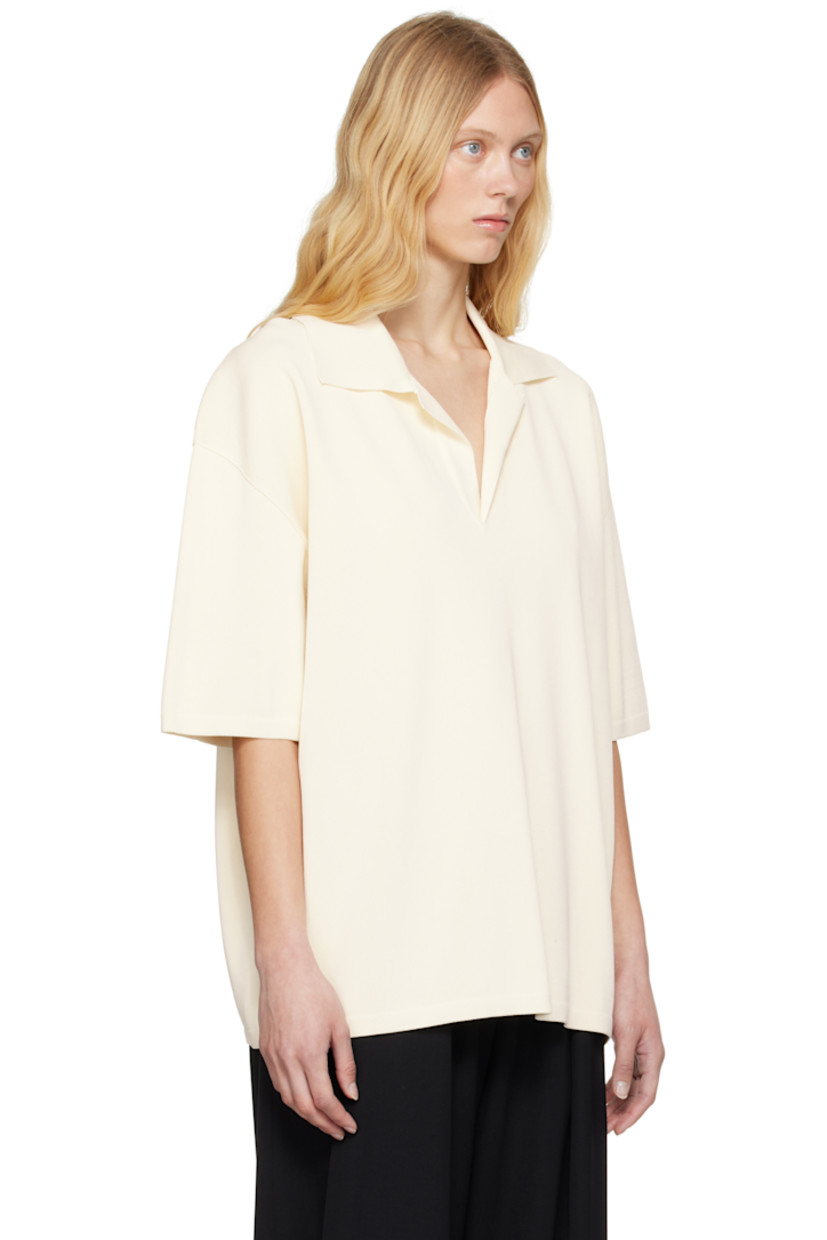 Knit viscose-blend polo.

· Rib-knit spread collar, hem, and cuffs
· Open placket
· Dropped shoulders

Supplier color: White cream