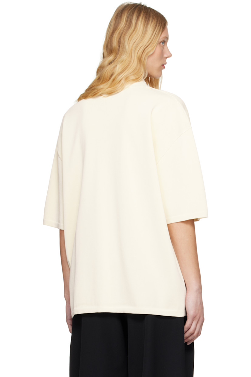 Knit viscose-blend polo.

· Rib-knit spread collar, hem, and cuffs
· Open placket
· Dropped shoulders

Supplier color: White cream