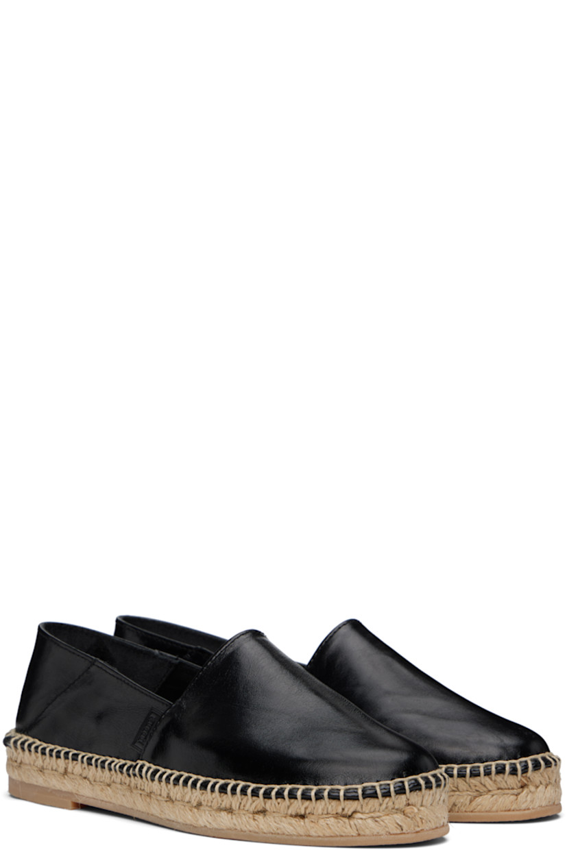 Crackled polished leather espadrilles in black. 

· Logo flag at outer side
· Unlined
· Blanket stitching at welt
· Braided jute midsole
· Treaded crêpe rubber sole 

Supplier color: Noir