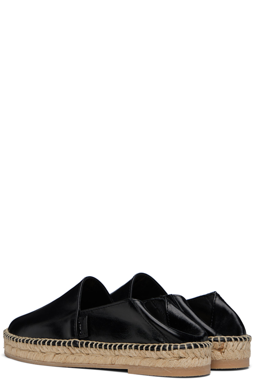 Crackled polished leather espadrilles in black. 

· Logo flag at outer side
· Unlined
· Blanket stitching at welt
· Braided jute midsole
· Treaded crêpe rubber sole 

Supplier color: Noir