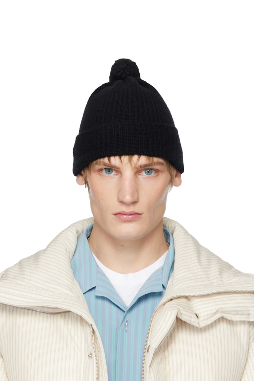 Rib-knit baby cashmere beanie in black.

· Pom-pom at crown
· Rolled brim

Part of the Tekla + AURALEE collaboration.

Available exclusively at SSENSE.

Supplier color: Top black