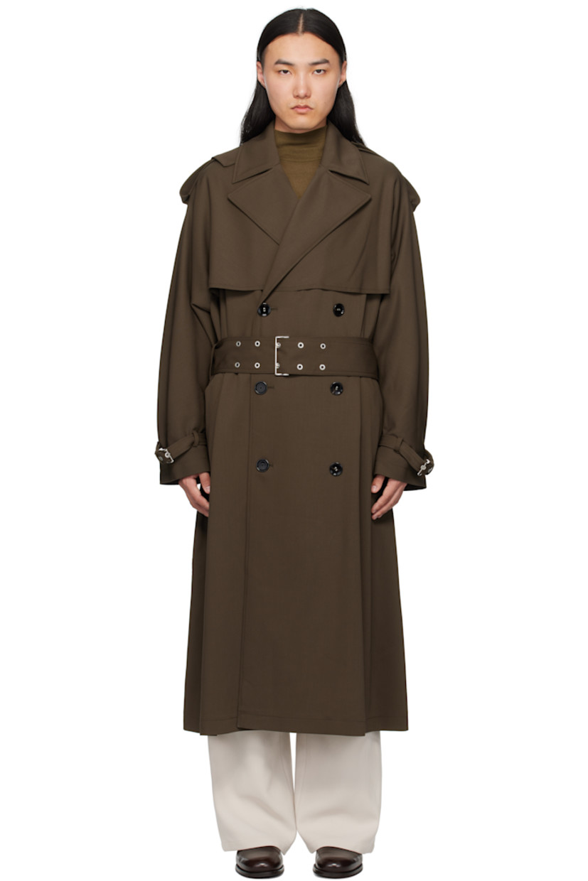 Virgin wool twill trench coat. 

· Notched lapel 
· Double-breasted button closure
· Storm flaps at front  
· Belt loops
· Detachable pin-buckle belt 
· Welt pockets
· Epaulets 
· Loops and pin-buckle strap at cuffs
· Logo plaque at back collar 
· Storm flap at back
· Central vent at back hem
· Full twill lining
· Horn hardware

Supplier color: Black olive
