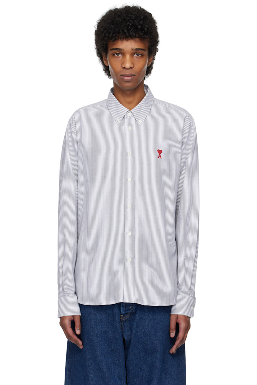 Cotton oxford cloth shirt. Stripes throughout.

· Button-down spread collar
· Button closure
· Embroidered logo at front
· Shirttail hem
· Pleated single-button barrel cuffs
· Mother-of-pearl hardware

Supplier color: Black/Natural white