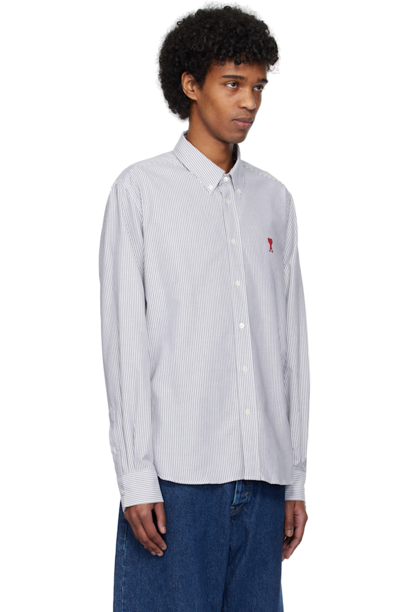 Cotton oxford cloth shirt. Stripes throughout.

· Button-down spread collar
· Button closure
· Embroidered logo at front
· Shirttail hem
· Pleated single-button barrel cuffs
· Mother-of-pearl hardware

Supplier color: Black/Natural white