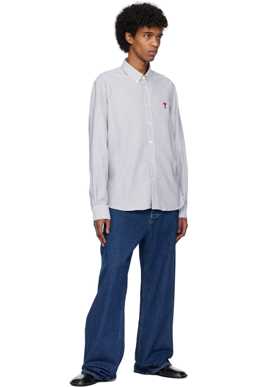 Cotton oxford cloth shirt. Stripes throughout.

· Button-down spread collar
· Button closure
· Embroidered logo at front
· Shirttail hem
· Pleated single-button barrel cuffs
· Mother-of-pearl hardware

Supplier color: Black/Natural white