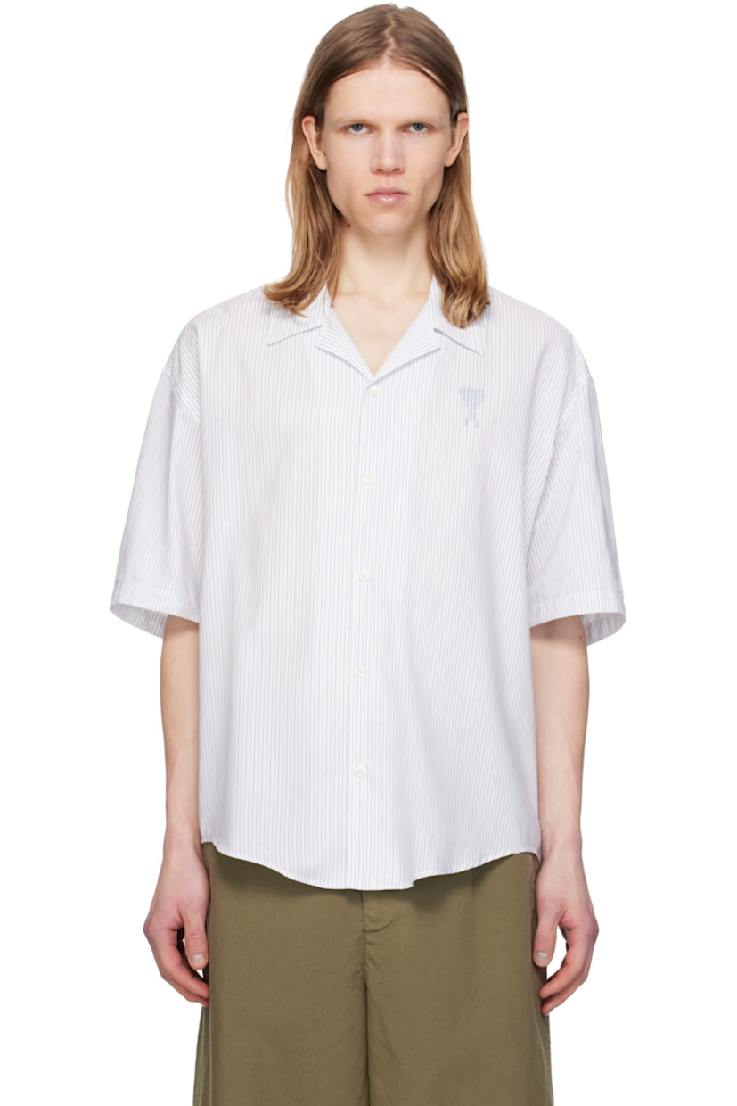 Boxy-fit cotton poplin shirt. Stripes throughout.

· Spread collar
· Button closure
· Logo printed at chest 
· Shirttail hem
· Dropped shoulders
· Mother-of-pearl hardware

Supplier color: White/Blue note