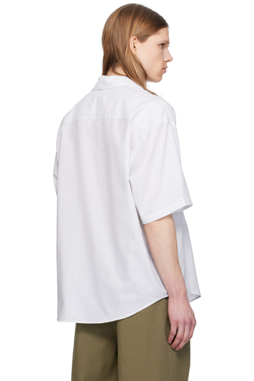 Boxy-fit cotton poplin shirt. Stripes throughout.

· Spread collar
· Button closure
· Logo printed at chest 
· Shirttail hem
· Dropped shoulders
· Mother-of-pearl hardware

Supplier color: White/Blue note