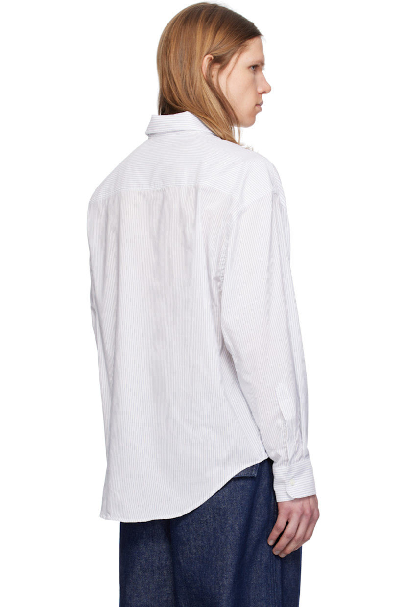 Boxy-fit cotton poplin shirt. Stripes throughout.

· Spread collar
· Button closure
· Logo printed at chest 
· Shirttail hem
· Dropped shoulders
· Pleated single-button barrel cuffs
· Mother-of-pearl hardware

Supplier color: White/Blue note
