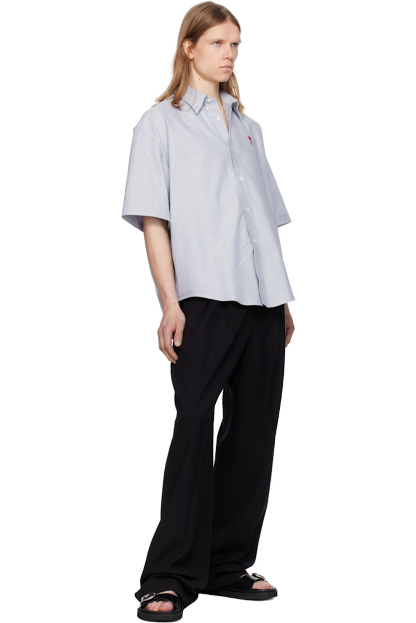 Boxy-fit cotton oxford cloth shirt.

· Button-down spread collar
· Button closure
· Logo embroidered at chest
· Shirttail hem
· Dropped shoulders
· Rolled cuffs
· Mother-of-pearl hardware

Supplier color: Blue note