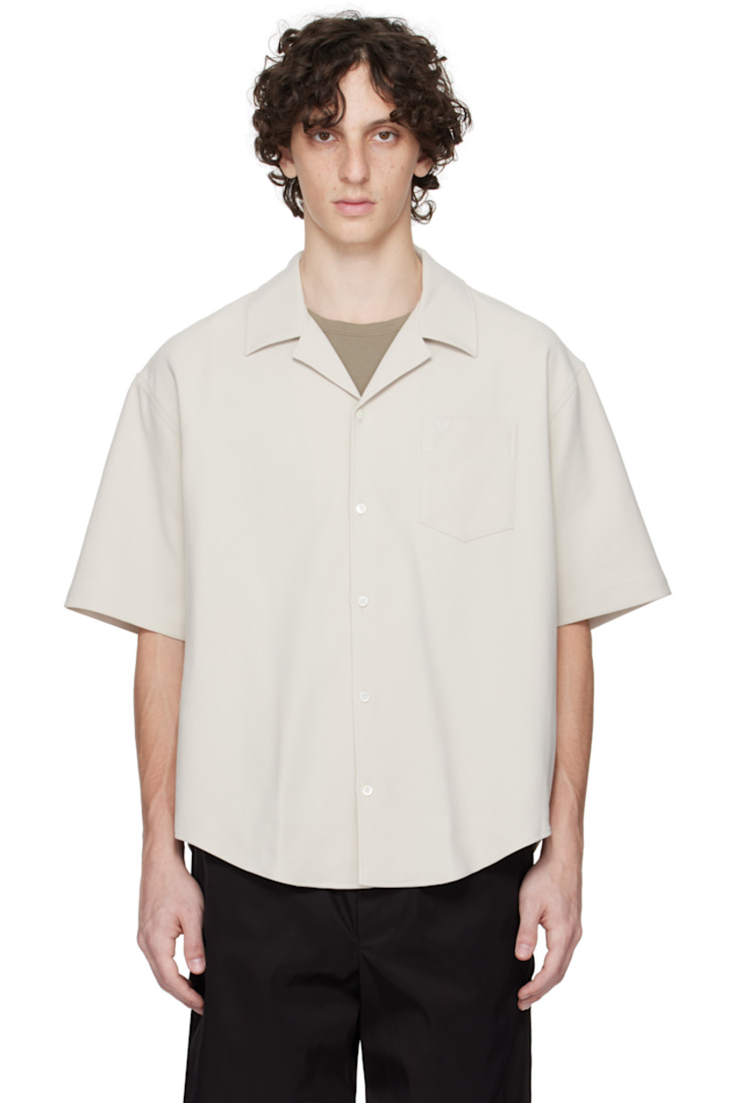 Cotton gabardine shirt.

· Open-spread collar
· Button closure
· Logo embroidered at patch pocket
· Shirttail hem
· Mother-of-pearl hardware

Supplier color: Mastic