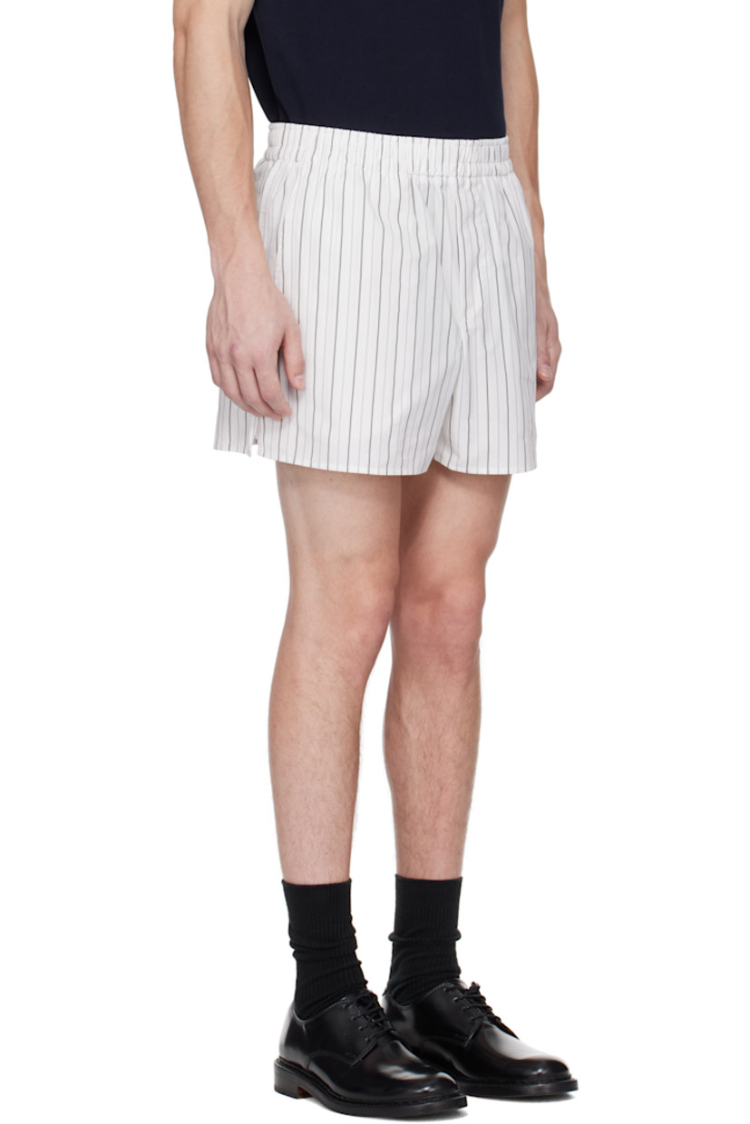 Cotton poplin shorts. Striped throughout.

· Elasticized waistband
· Three-pocket styling
· Mock fly
· Logo patch at back pocket

Supplier color: Off-white/Blue