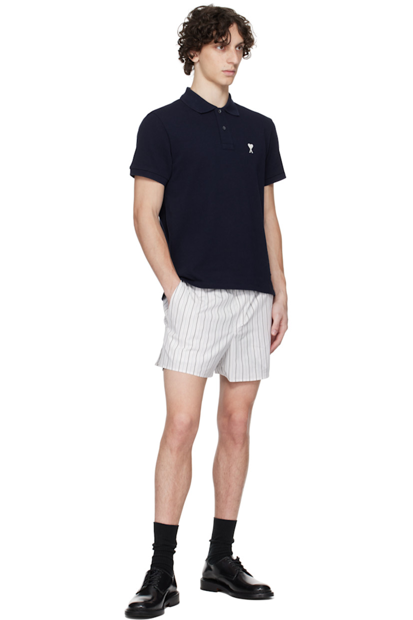 Cotton poplin shorts. Striped throughout.

· Elasticized waistband
· Three-pocket styling
· Mock fly
· Logo patch at back pocket

Supplier color: Off-white/Blue