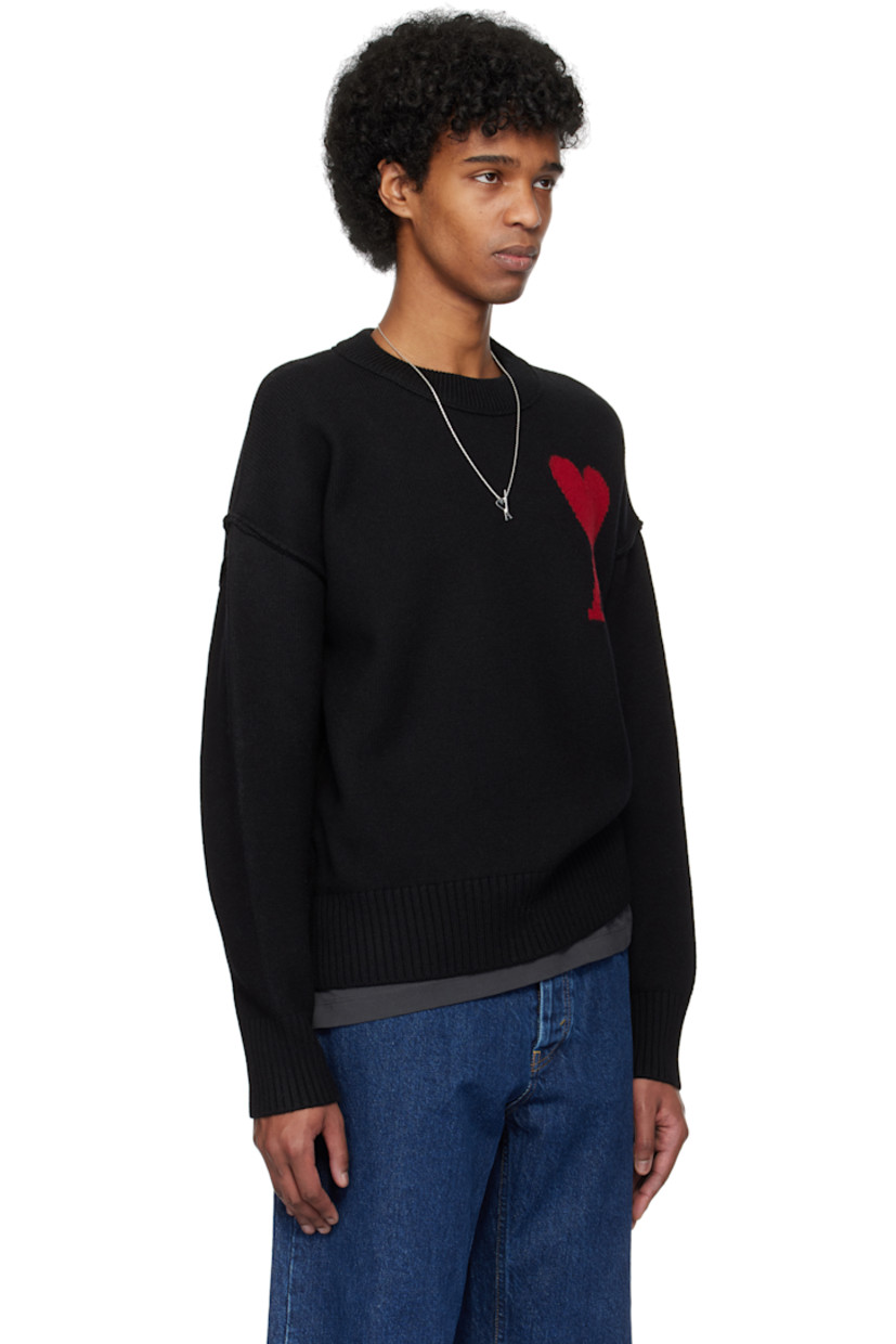 Felted knit virgin wool sweater. Inverted seams throughout.

· Rib-knit crewneck, hem, and cuffs
· Intarsia logo at chest
· Dropped shoulders

Supplier color: Black/Red