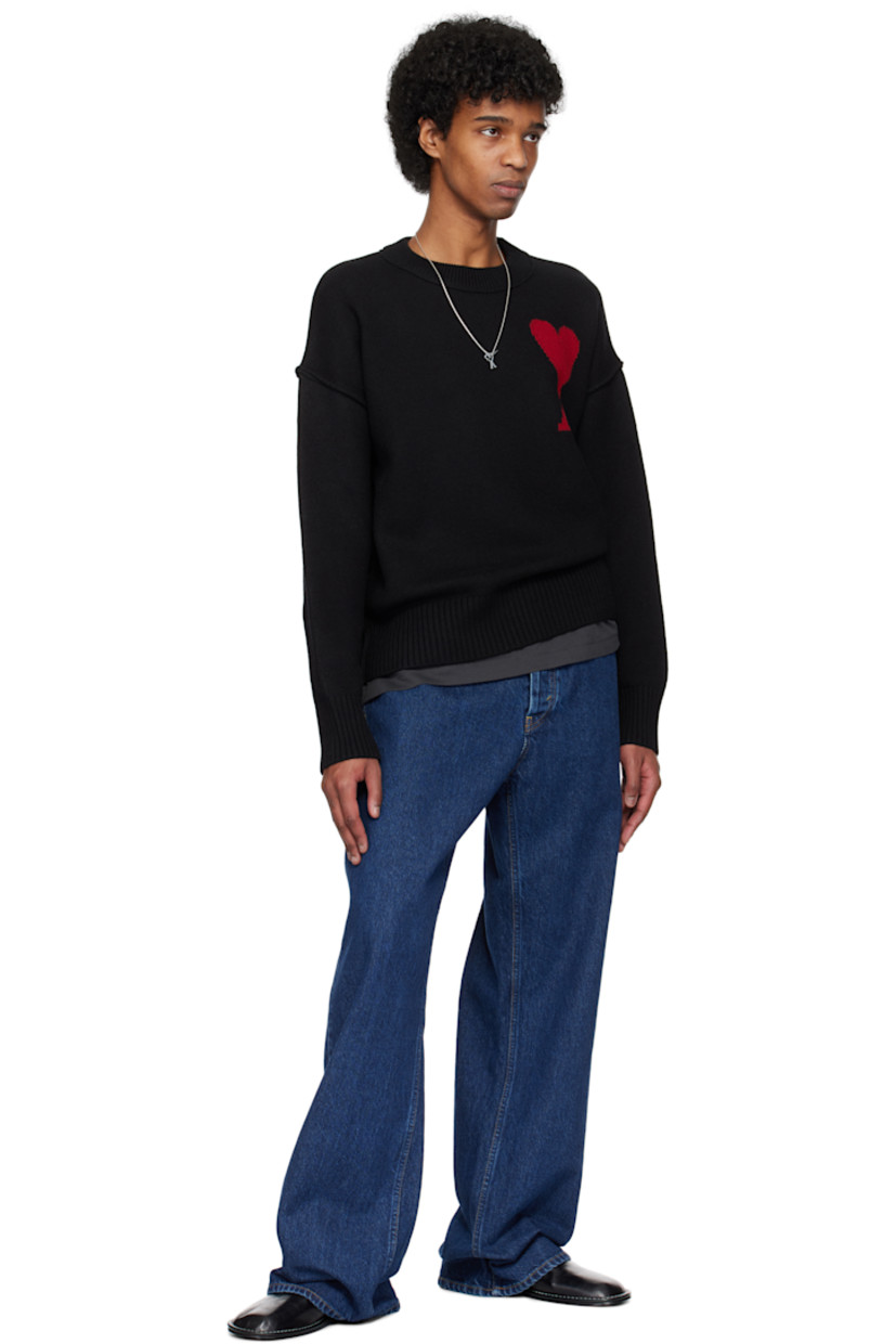Felted knit virgin wool sweater. Inverted seams throughout.

· Rib-knit crewneck, hem, and cuffs
· Intarsia logo at chest
· Dropped shoulders

Supplier color: Black/Red