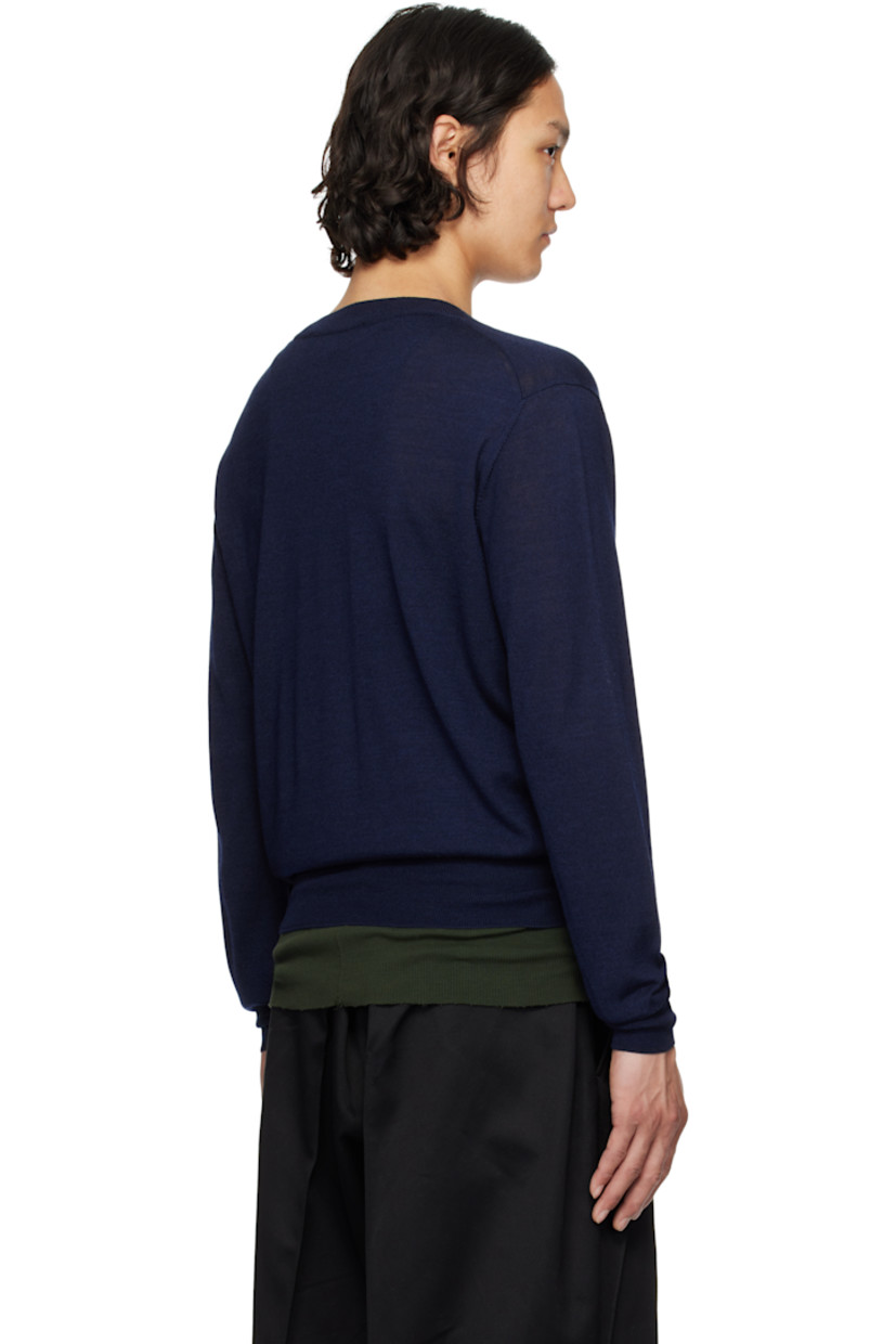 Knit extrafine merino wool- and silk-blend sweater. 

· Rib-knit V-neck, hem, and cuffs
· Logo embroidered at front hem 
· Dropped shoulders

Supplier color: Navy blue