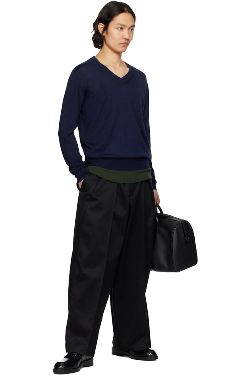 Knit extrafine merino wool- and silk-blend sweater. 

· Rib-knit V-neck, hem, and cuffs
· Logo embroidered at front hem 
· Dropped shoulders

Supplier color: Navy blue