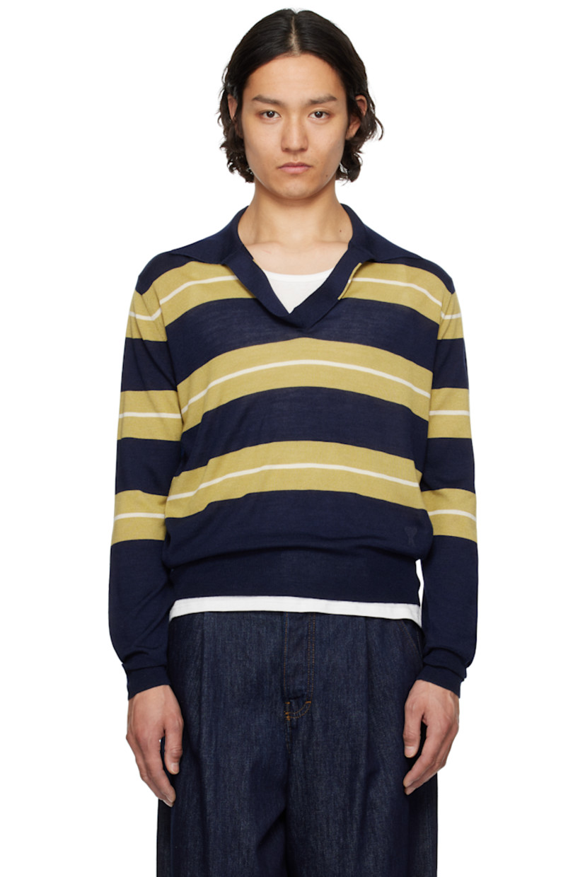 Knit extrafine merino wool- and silk-blend polo. Intarsia stripes throughout.

· Rib-knit open spread collar, hem, and cuffs
· Logo embroidered at front hem 

Supplier color: Navy/Havana/White