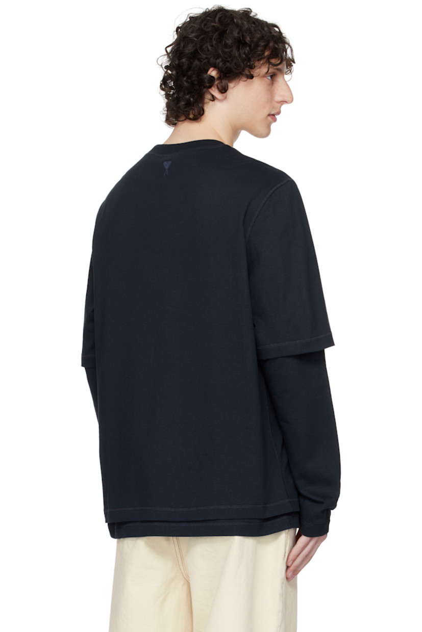 Organic cotton jersey T-shirt.

· Layered sleeves
· Rib-knit crewneck
· Logo bonded at chest
· Logo embroidered at back collar

Supplier color: Navy blue