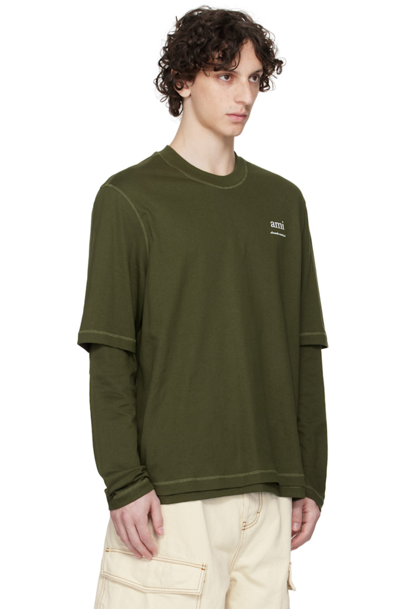 Organic cotton jersey T-shirt.

· Layered sleeves
· Rib-knit crewneck
· Logo bonded at chest
· Logo embroidered at back collar

Supplier color: Loden
