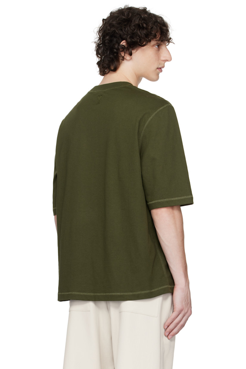 Organic cotton jersey T-shirt.

· Rib-knit crewneck
· Logo bonded at chest
· Logo embroidered at back collar

Supplier color: Loden