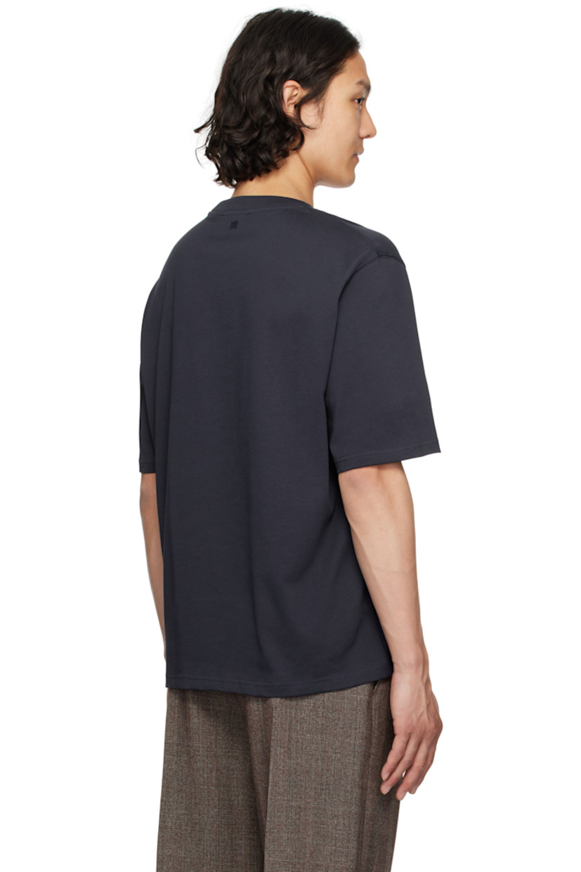 Organic cotton jersey T-shirt. 

· Rib-knit crewneck
· Woven logo appliqué at chest
· Dropped shoulders
· Logo embroidered at back collar

Supplier color: Navy blue
