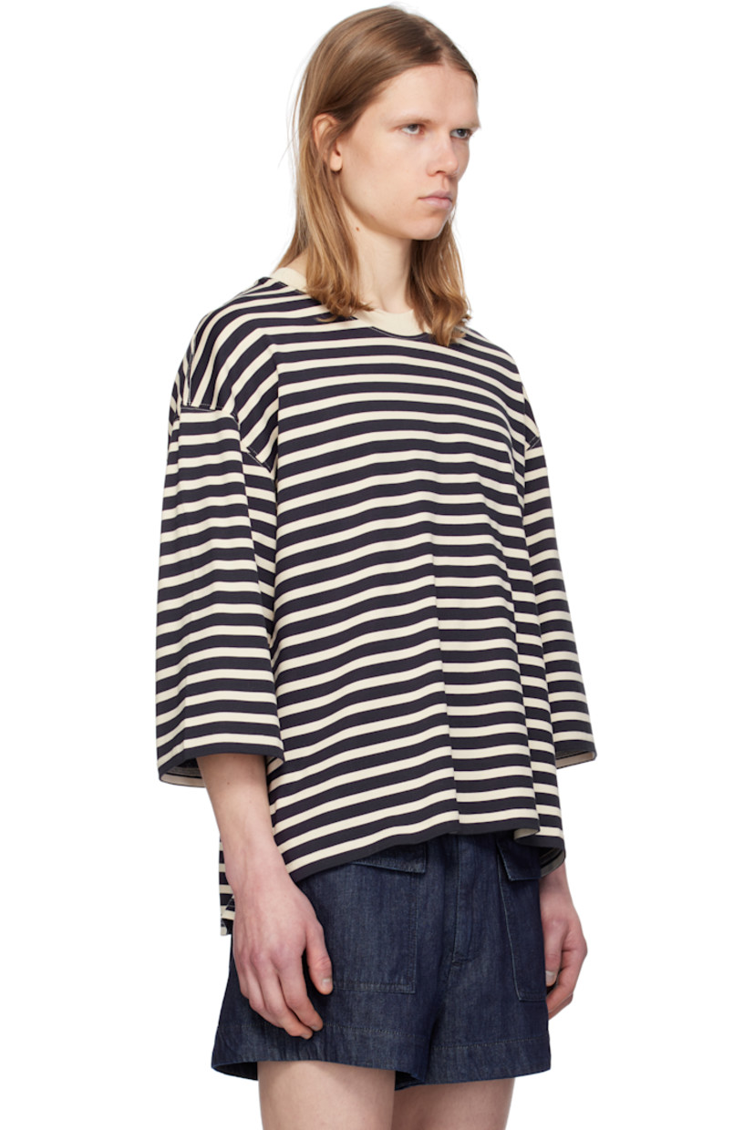 Loose-fit cotton jersey T-shirt. Stripes throughout.

· Rib-knit crewneck
· Logo patch at hem 
· Vented side seams
· Dropped shoulders
· Three-quarter sleeves 
· Logo embroidered at back collar

Supplier color: Navy blue/White cream