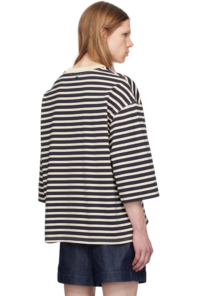Loose-fit cotton jersey T-shirt. Stripes throughout.

· Rib-knit crewneck
· Logo patch at hem 
· Vented side seams
· Dropped shoulders
· Three-quarter sleeves 
· Logo embroidered at back collar

Supplier color: Navy blue/White cream