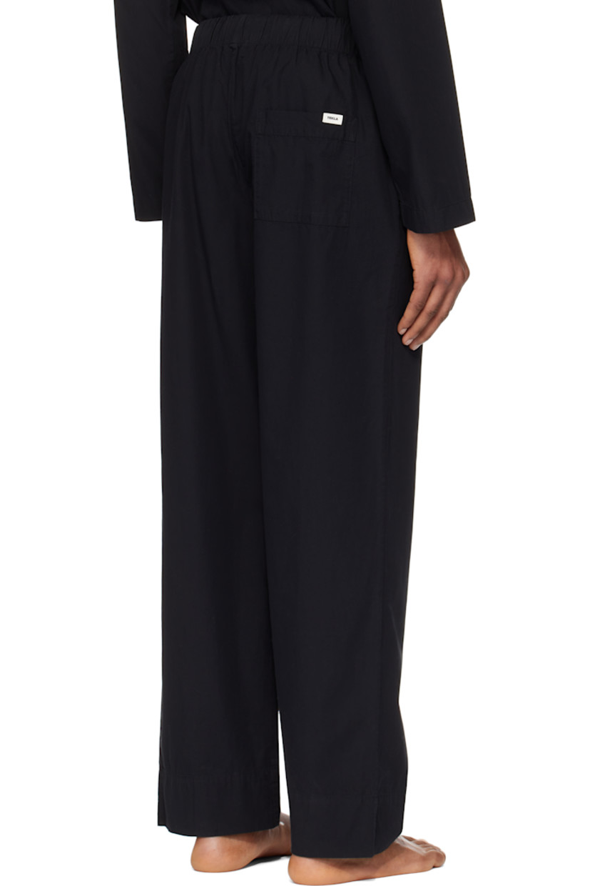 Stonewashed lightweight organic cotton poplin pyjama pants. Oeko-Tex® Standard 100-certified.

· Straight-leg and loose-fit
· Drawstring at elasticized waistband
· Three-pocket styling
· Button fly
· Logo flag at back pocket

Supplier color: All black
