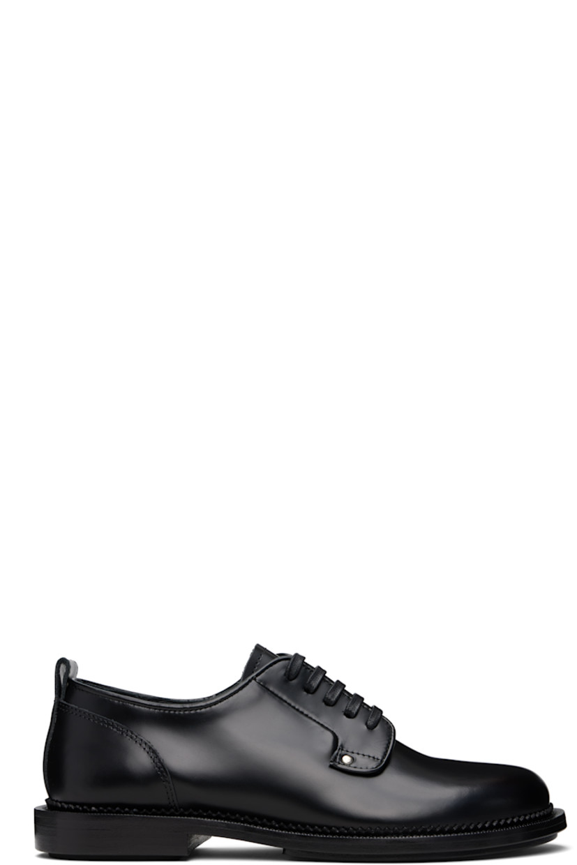 Polished and vegetable-tanned leather derbys in black.

· Lace-up closure
· Pull-loop at heel collar
· Serrated edge at welt
· Stacked leather heel with rubber injection
· Leather sole with rubber injection

Supplier color: Black