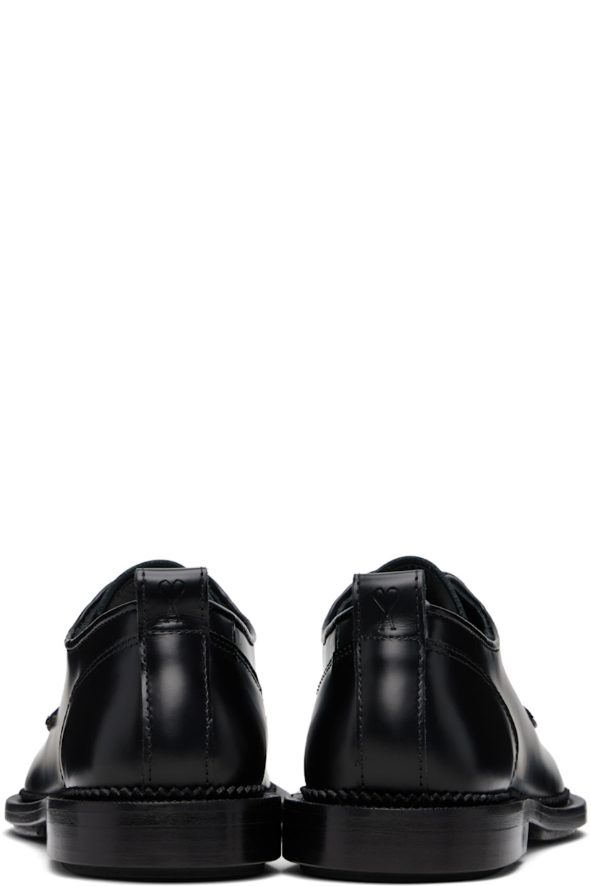 Polished and vegetable-tanned leather derbys in black.

· Lace-up closure
· Pull-loop at heel collar
· Serrated edge at welt
· Stacked leather heel with rubber injection
· Leather sole with rubber injection

Supplier color: Black