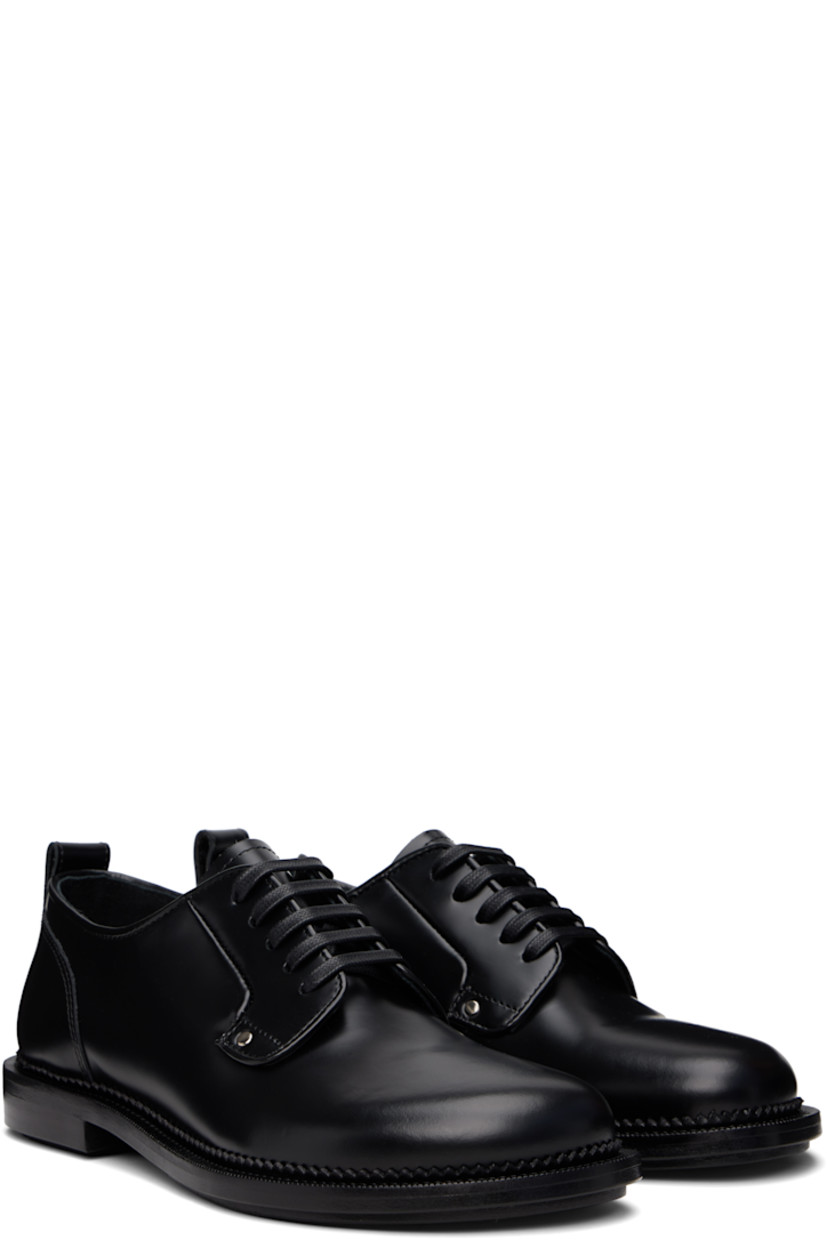 Polished and vegetable-tanned leather derbys in black.

· Lace-up closure
· Pull-loop at heel collar
· Serrated edge at welt
· Stacked leather heel with rubber injection
· Leather sole with rubber injection

Supplier color: Black