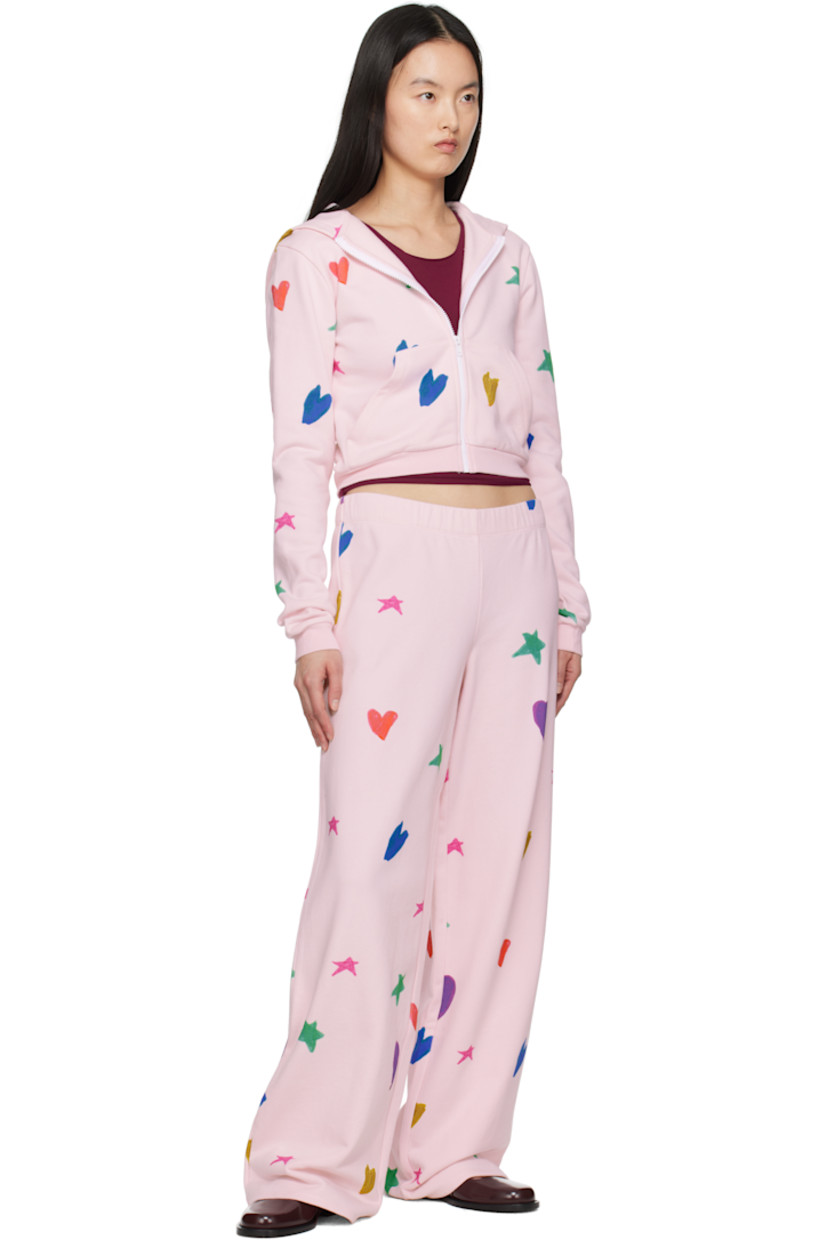 French terry hoodie. Graphic pattern printed throughout.

· Zip closure
· Patch pockets
· Rib-knit cropped hem and cuffs 

Featuring artwork made in collaboration with the children of RIVER FUND NY.

Supplier color: Pink