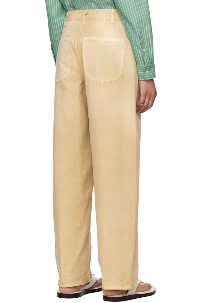 Garment-dyed organic cotton duck canvas trousers. Fading throughout. 

· Wide-leg
· Belt loops
· Five-pocket styling
· Zip fly
· Twisted outseams

Supplier color: Light beige