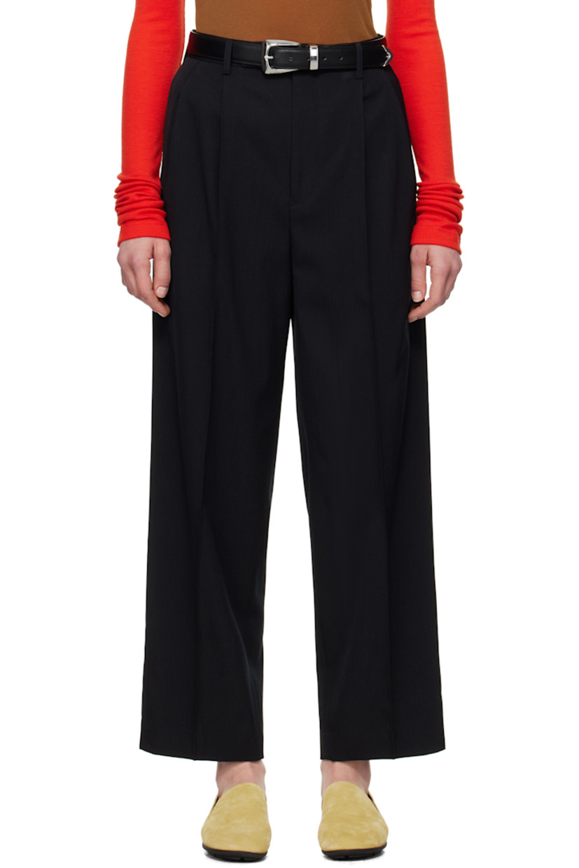 Super 140s wool gabardine trousers. Water-repellent and wrinkle-resistant.

· Loose-fit and tapered
· Belt loops
· Four-pocket styling
· Zip fly
· Pleats at front
· Creased legs
· Partially lined

Supplier color: Top black