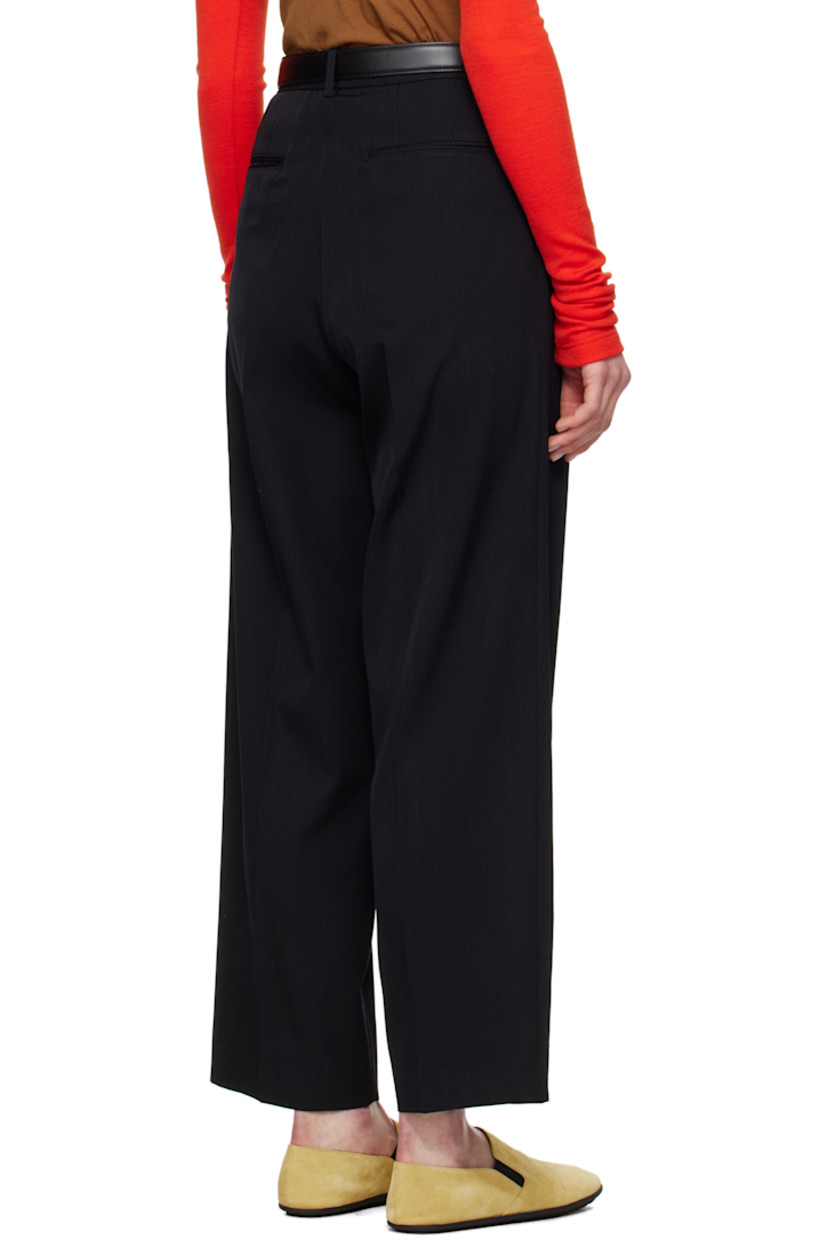 Super 140s wool gabardine trousers. Water-repellent and wrinkle-resistant.

· Loose-fit and tapered
· Belt loops
· Four-pocket styling
· Zip fly
· Pleats at front
· Creased legs
· Partially lined

Supplier color: Top black