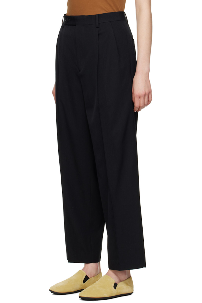 Super 140s wool gabardine trousers. Water-repellent and wrinkle-resistant.

· Loose-fit and tapered
· Belt loops
· Four-pocket styling
· Zip fly
· Pleats at front
· Creased legs
· Partially lined

Supplier color: Top black