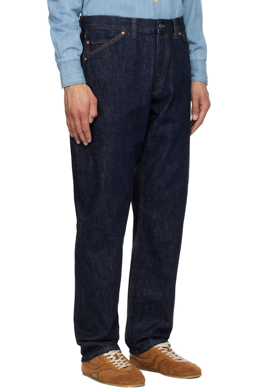 Stonewashed 14.2 oz non-stretch selvage denim jeans.

· Tapered leg
· High-rise
· Belt loops
· Five-pocket styling
· Button-fly
· Suede logo patch at back waistband
· Logo-engraved silver- and copper-tone hardware
· Contrast stitching in tan

Supplier color: Indigo rinse