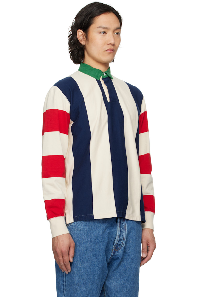 Knit cotton polo. Stripes throughout.

· Denim spread collar
· Concealed two-button placket
· Tennis-tail hem
· Rib-knit cuffs

Supplier color: Navy/Red/Ecru