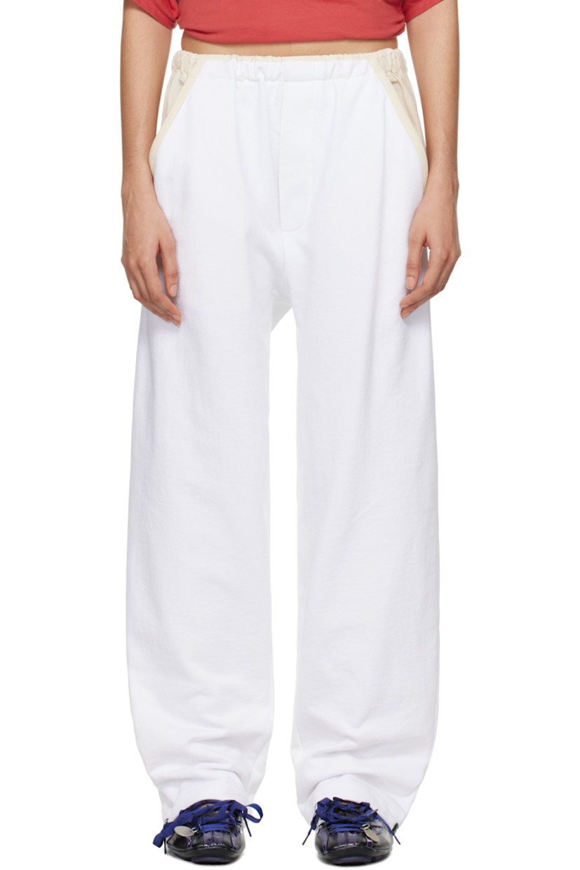 French terry lounge pants.

· Hopsack trim at elasticized waistband and pockets
· Two-pocket styling 
· Mock-fly 
· Jacquard graphic patch at cuffs

Supplier color: Zinc