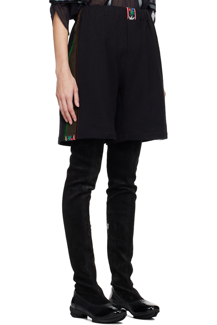 French terry shorts. 

· Embroidered floral trim at elasticized waistband and cuffs
· Mock-fly
· Corduroy and velvet trim at outseams 

Supplier color: Comet