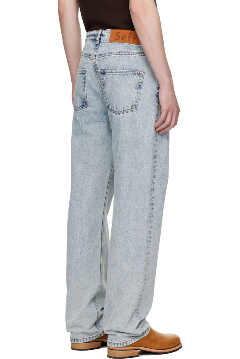 Straight-leg stonewashed 13 oz non-stretch denim jeans. Fading throughout.

· Mid-rise
· Belt loops
· Five-pocket styling
· Button fly
· Suede logo patch at back waistband
· Logo-engraved silver-tone hardware
· Contrast stitching in tan 

Supplier color: New stone wash