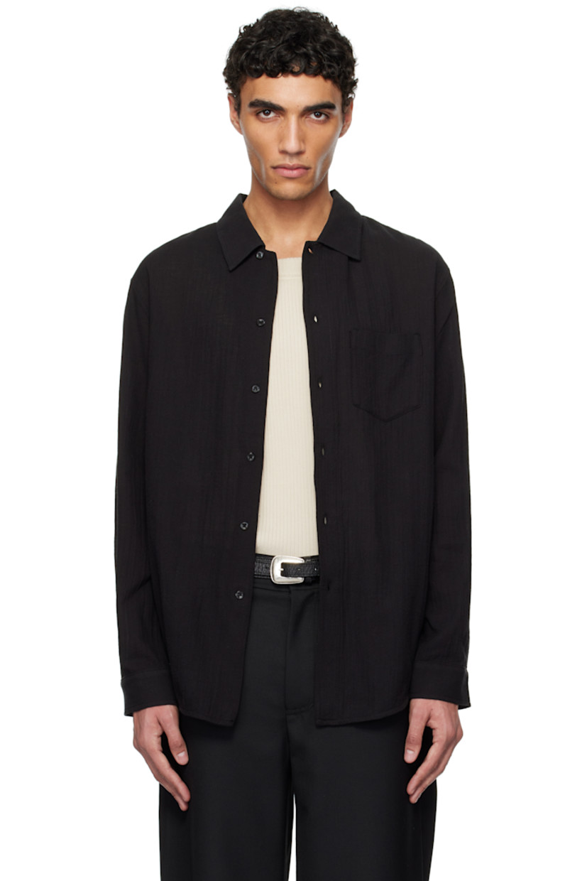 Lightweight cotton voile shirt.

· Spread collar
· Button closure
· Patch pocket at chest
· Shirttail hem
· Adjustable single-button barrel cuffs
· Box pleat at back yoke
· Mother-of-pearl hardware

Supplier color: Black