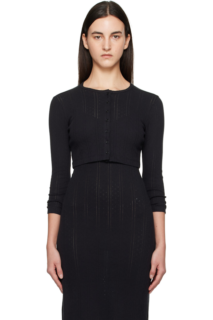 Pointelle-knit GOTS-certified organic cotton cardigan.

· Picot trim at crewneck
· Button closure
· Cropped hem

Supplier color: Black