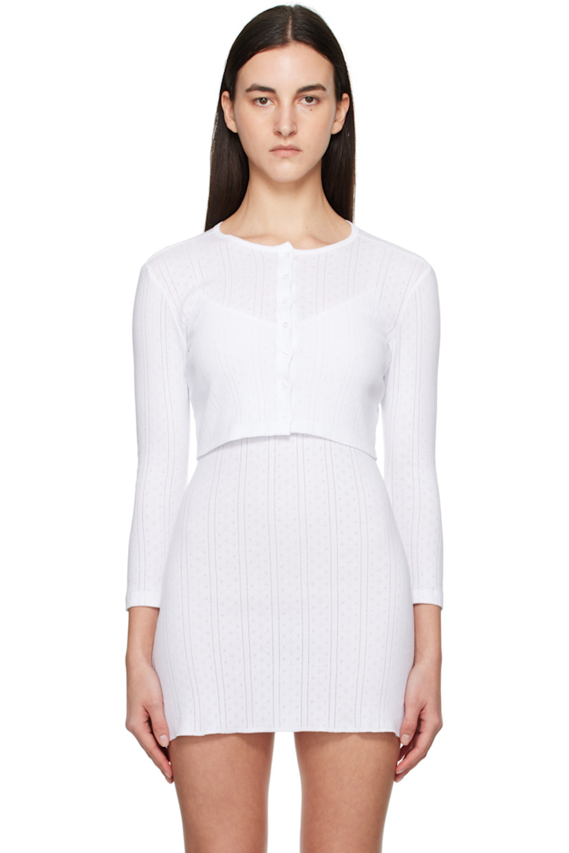Pointelle-knit GOTS-certified organic cotton cardigan.

· Picot trim at crewneck
· Button closure
· Cropped hem

Supplier color: White