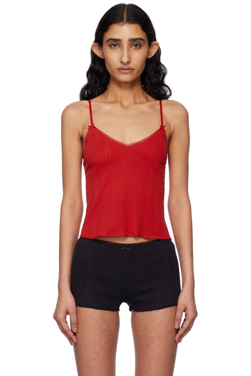 GOTS-certified organic cotton pointelle camisole.

· Scalloped lace trim at scoop neck
· Bow accents at front
· Cropped hem
· Adjustable elasticized spaghetti straps

Supplier color: Red