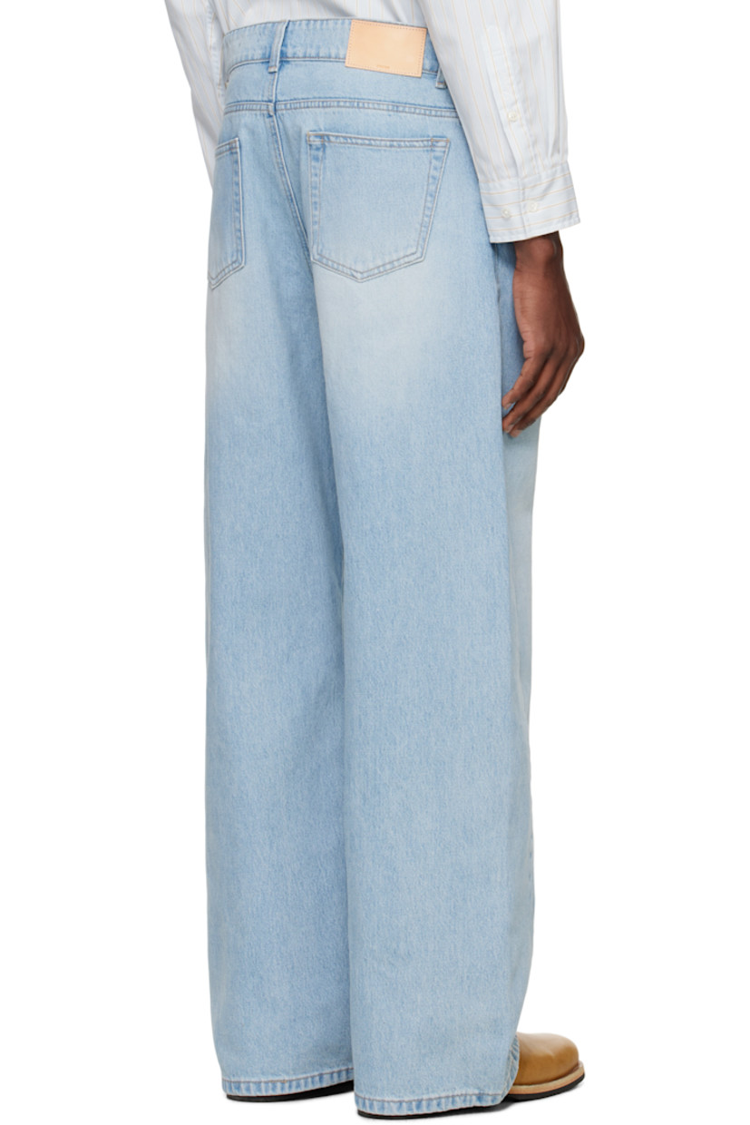 Wide-leg non-stretch denim jeans. Subtle fading and whiskering throughout.

· Belt loops
· Five-pocket styling
· Zip fly
· Twisted outseams
· Logo hardware at back belt loop
· Leather logo patch at back waistband
· Logo-engraved silver-tone hardware
· Contrast stitching in beige

Supplier color: Light blue