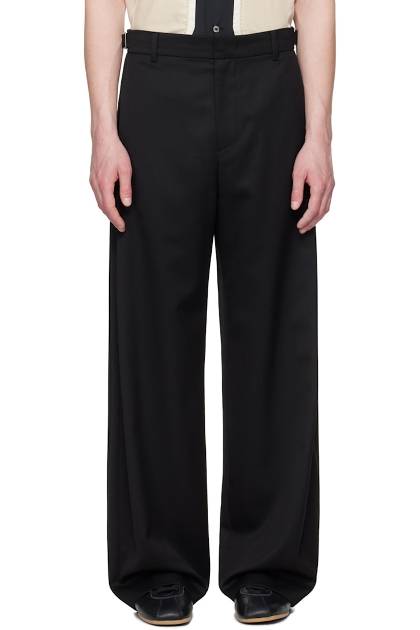 Wide-leg wool twill trousers.

· Belt loops
· Adjustable cinch tabs at waistband
· Four-pocket styling
· Zip fly
· Pleat at outseams
· Logo hardware at back waistband
· Partial plain-woven lining  

Available exclusively at SSENSE. 

Supplier color: Bk