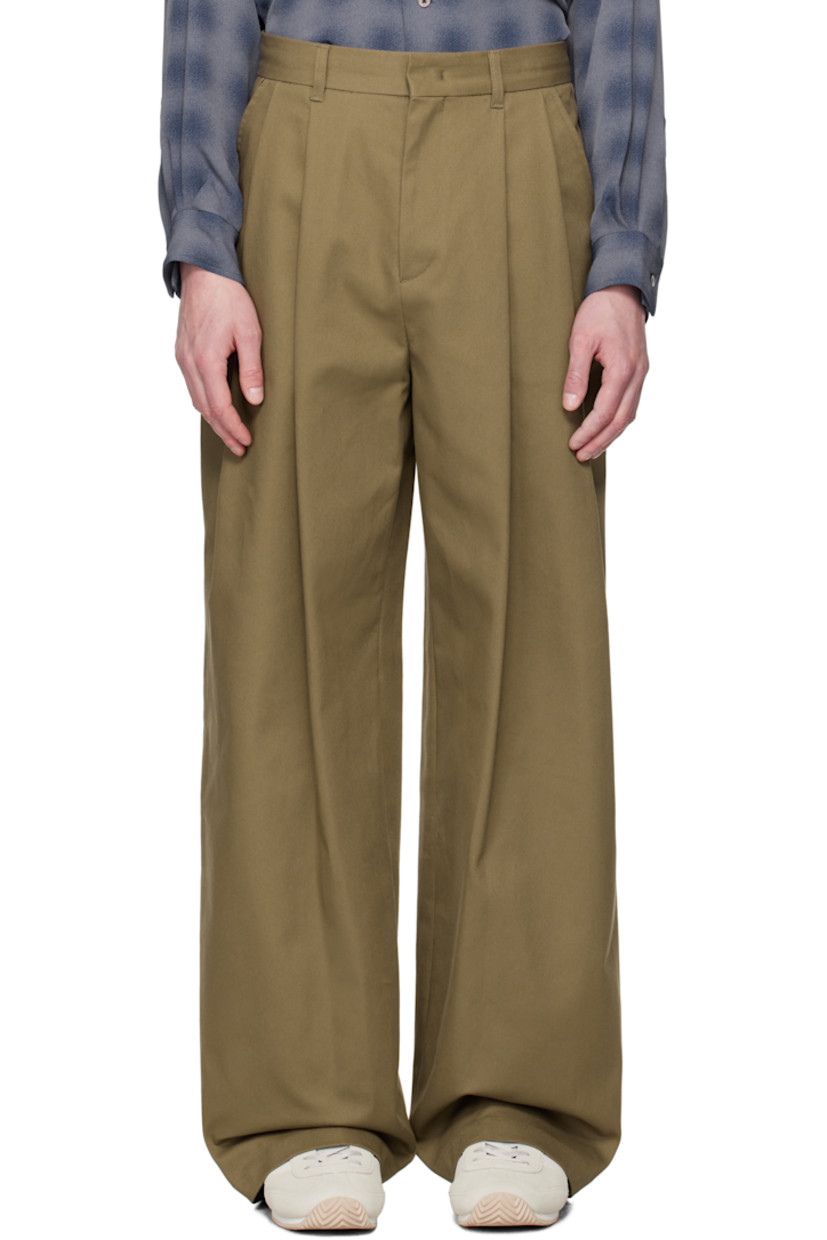 Wide-leg stretch cotton twill trousers.

· Belt loops
· Four-pocket styling
· Zip fly
· Pleats at front 
· Logo hardware at back waistband
· Partial plain-woven lining 

Available exclusively at SSENSE. 

Supplier color: Br