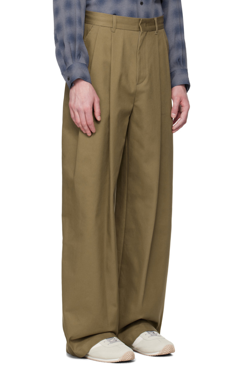 Wide-leg stretch cotton twill trousers.

· Belt loops
· Four-pocket styling
· Zip fly
· Pleats at front 
· Logo hardware at back waistband
· Partial plain-woven lining 

Available exclusively at SSENSE. 

Supplier color: Br